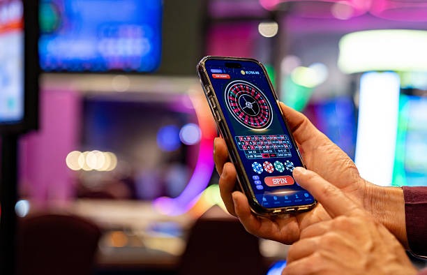 Close-up of live dealer hands dealing cards at a professional blackjack table